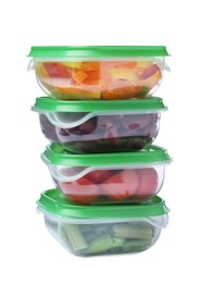 Photo of Fresh vegetables in plastic containers on white background