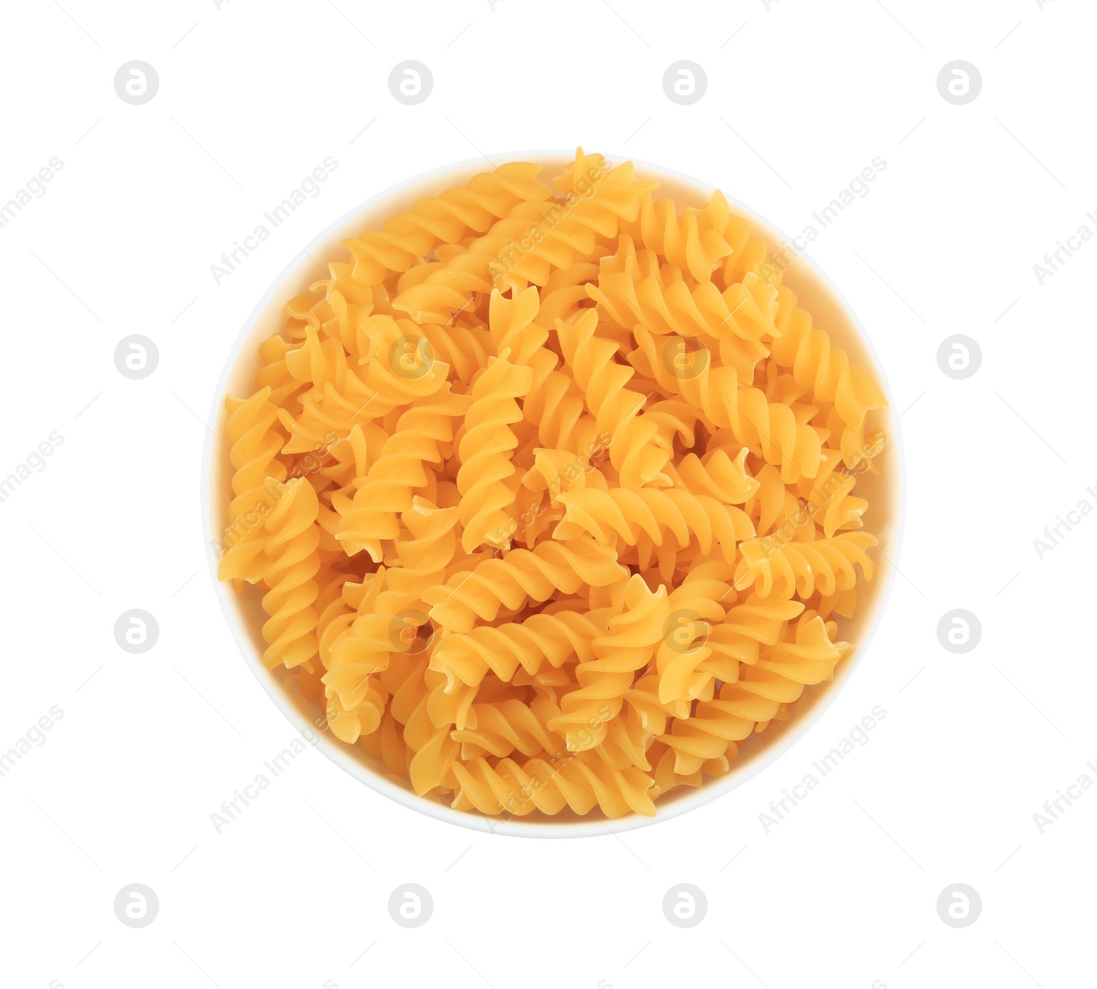 Photo of Raw fusilli pasta in bowl isolated on white, top view