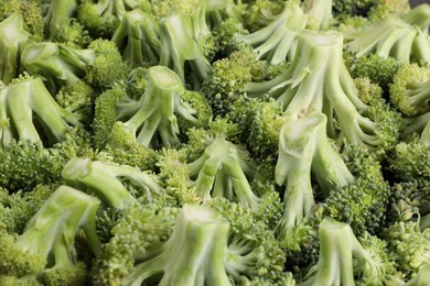 Photo of Fresh raw broccoli as background, closeup view