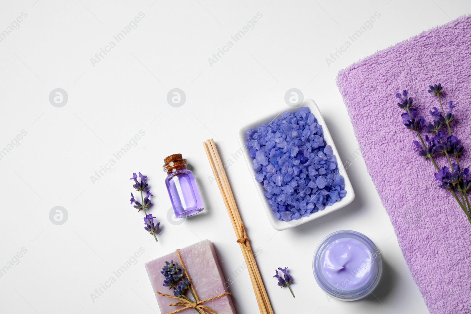 Photo of Cosmetic products and lavender flowers on white background, flat lay