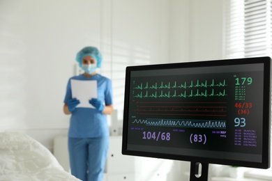 Photo of Monitor with cardiogram in hospital, focus on screen. Space for text