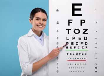 Ophthalmologist pointing at vision test chart on light blue background