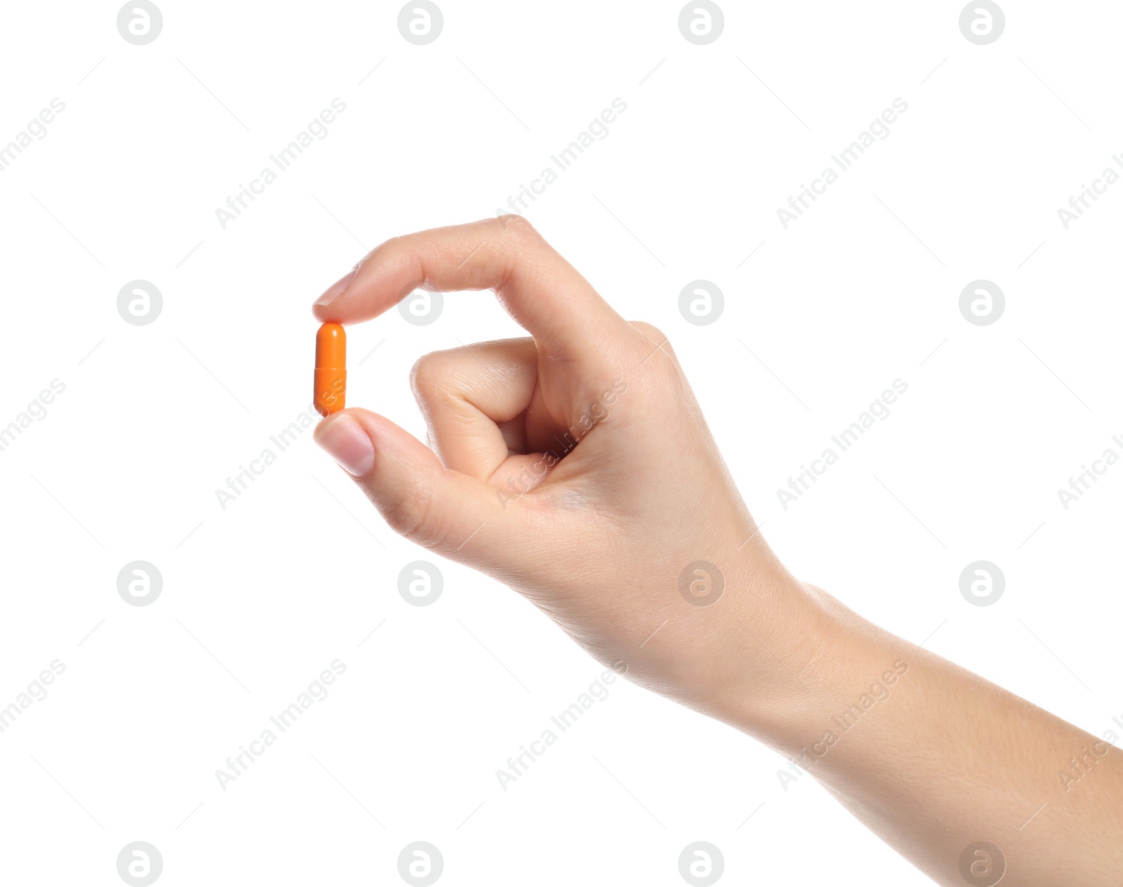 Photo of Woman holding color pill on white background, closeup