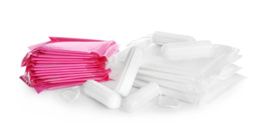 Photo of Tampons and disposable menstrual pads on white background