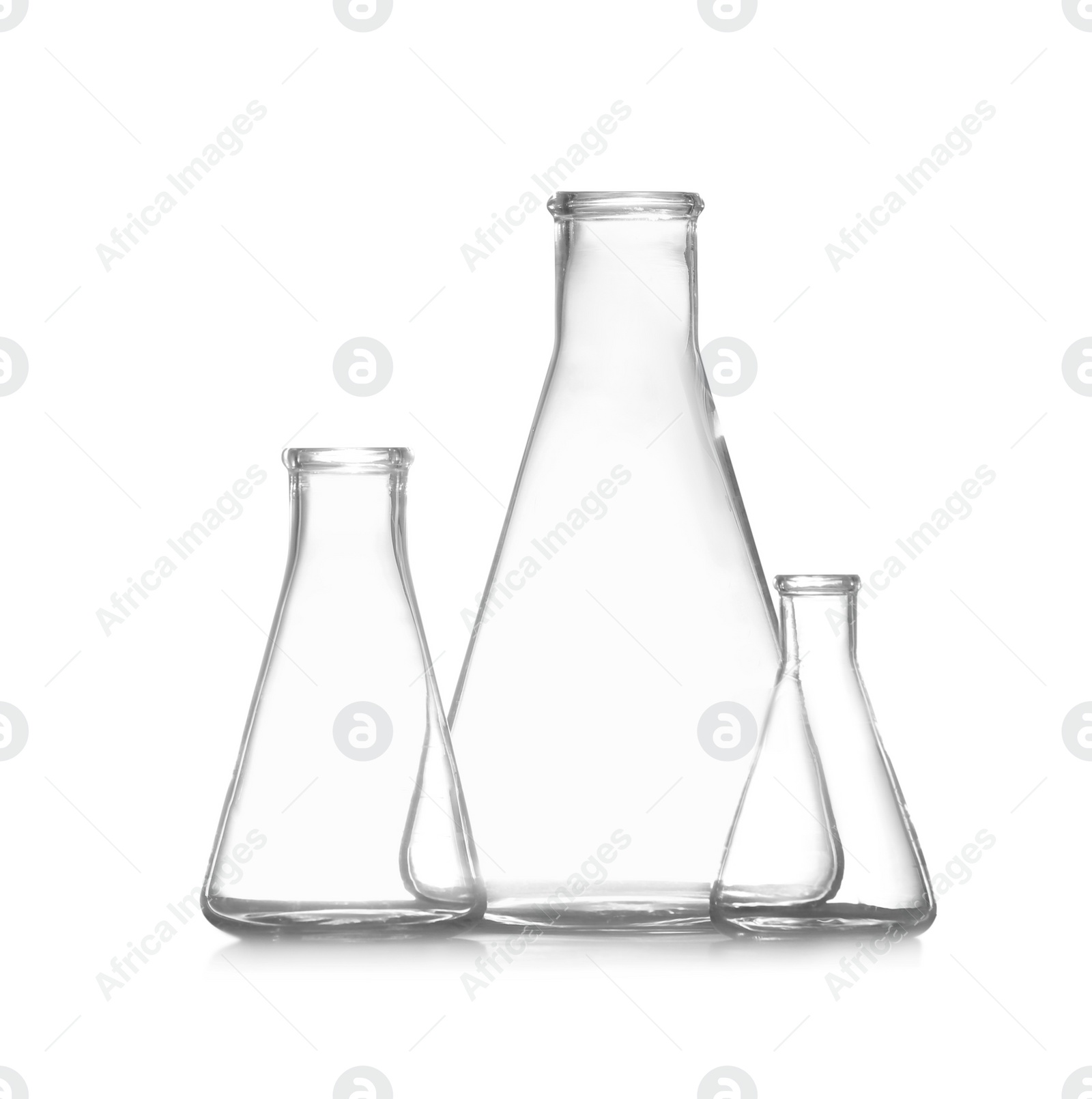Photo of Empty conical flasks on white background. Chemistry glassware