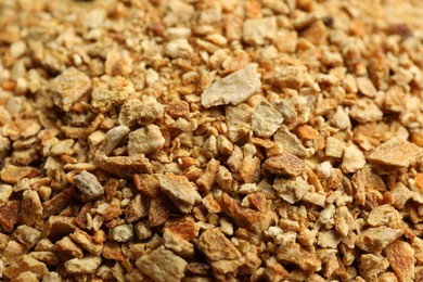 Photo of Dried orange zest seasoning as background, closeup