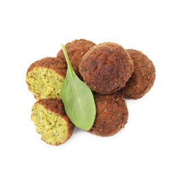 Photo of Delicious falafel balls and basil isolated on white, top view