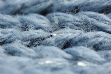 Light blue knitted fabric as background, macro