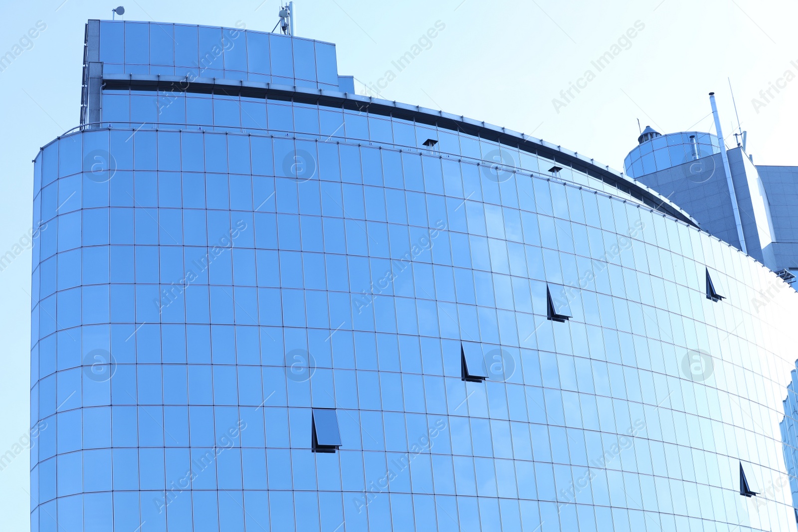 Photo of Office building with tinted windows. Modern architectural design