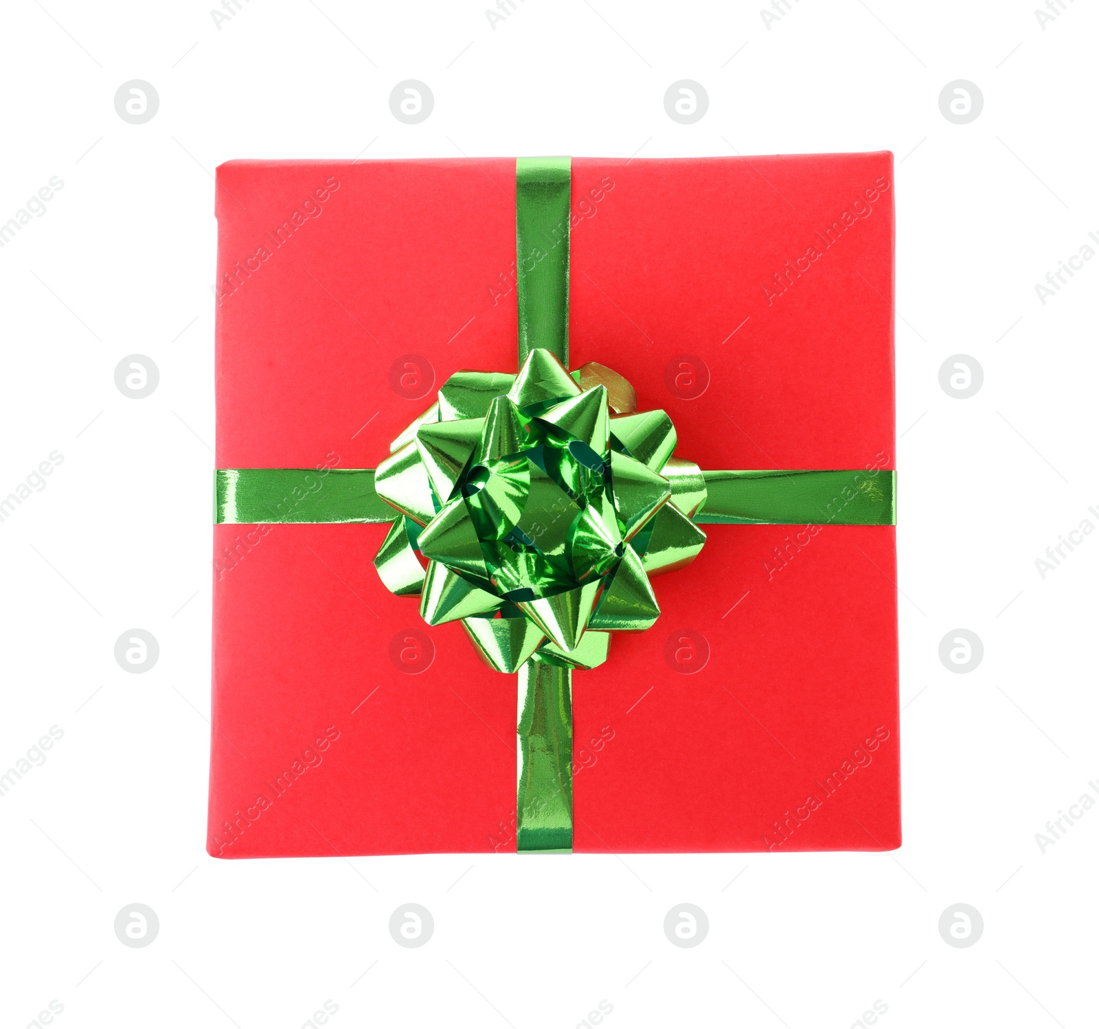 Photo of Christmas gift box decorated with ribbon bow on white background, top view