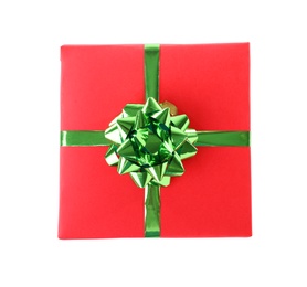 Christmas gift box decorated with ribbon bow on white background, top view