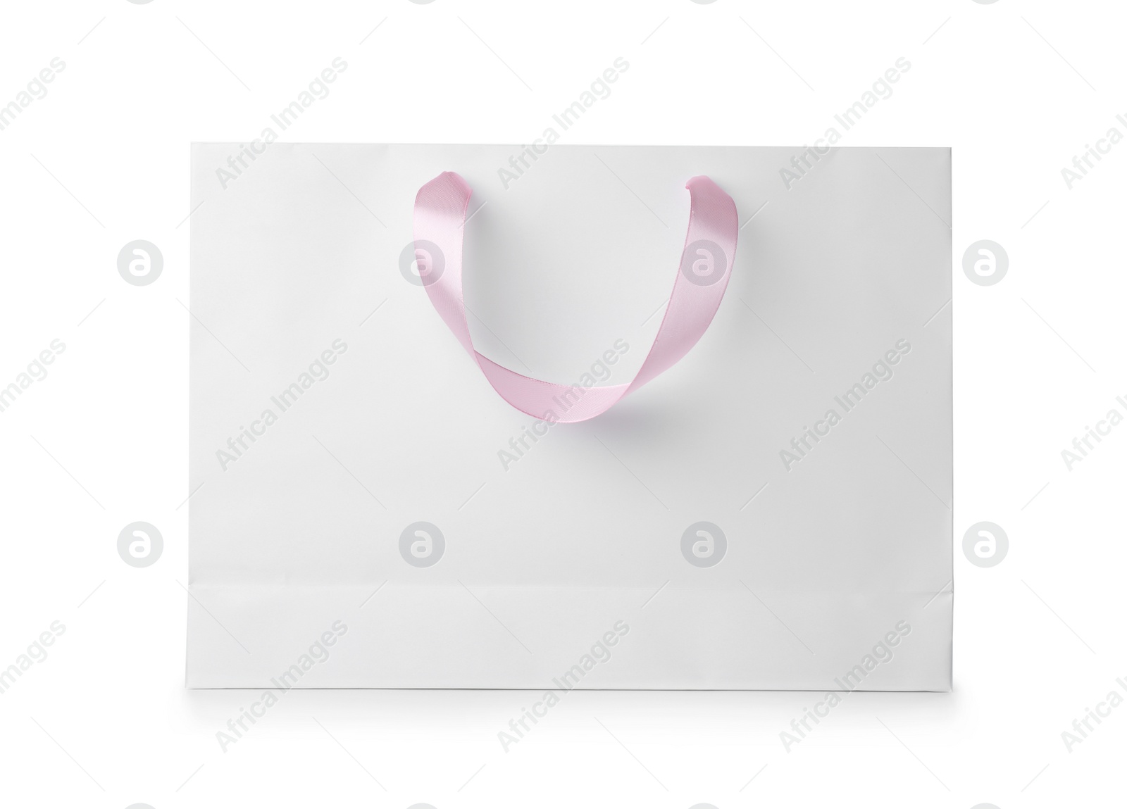 Photo of Paper shopping bag with ribbon handles on white background. Mockup for design