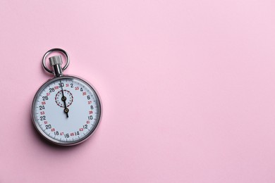 Vintage timer on pink background, top view. Space for text