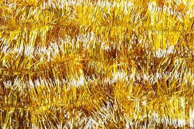 Bright yellow tinsel as background. Festive decoration