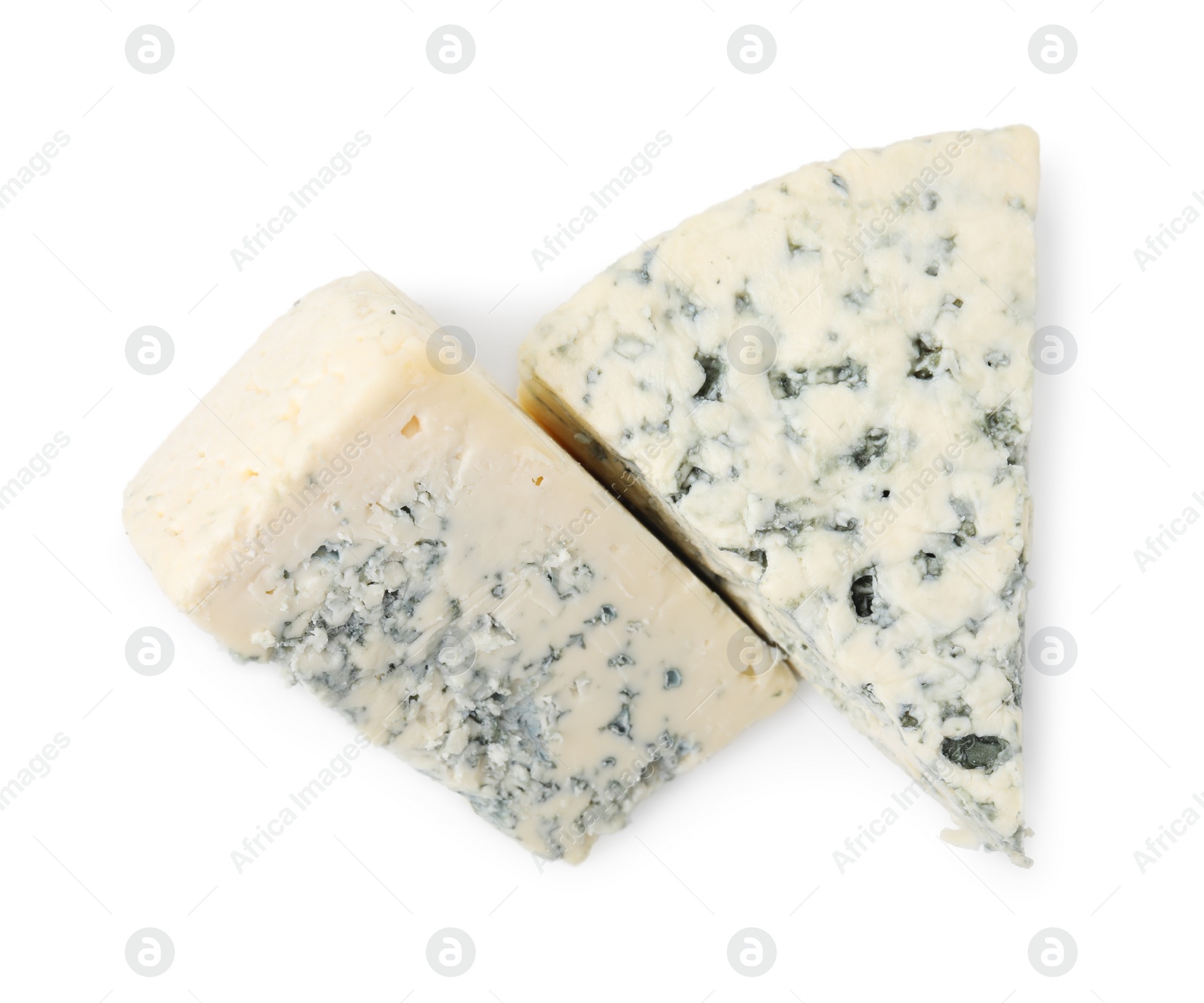 Photo of Pieces of delicious blue cheese isolated on white, top view