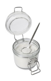 Photo of Baking powder in glass jar and spoon isolated on white