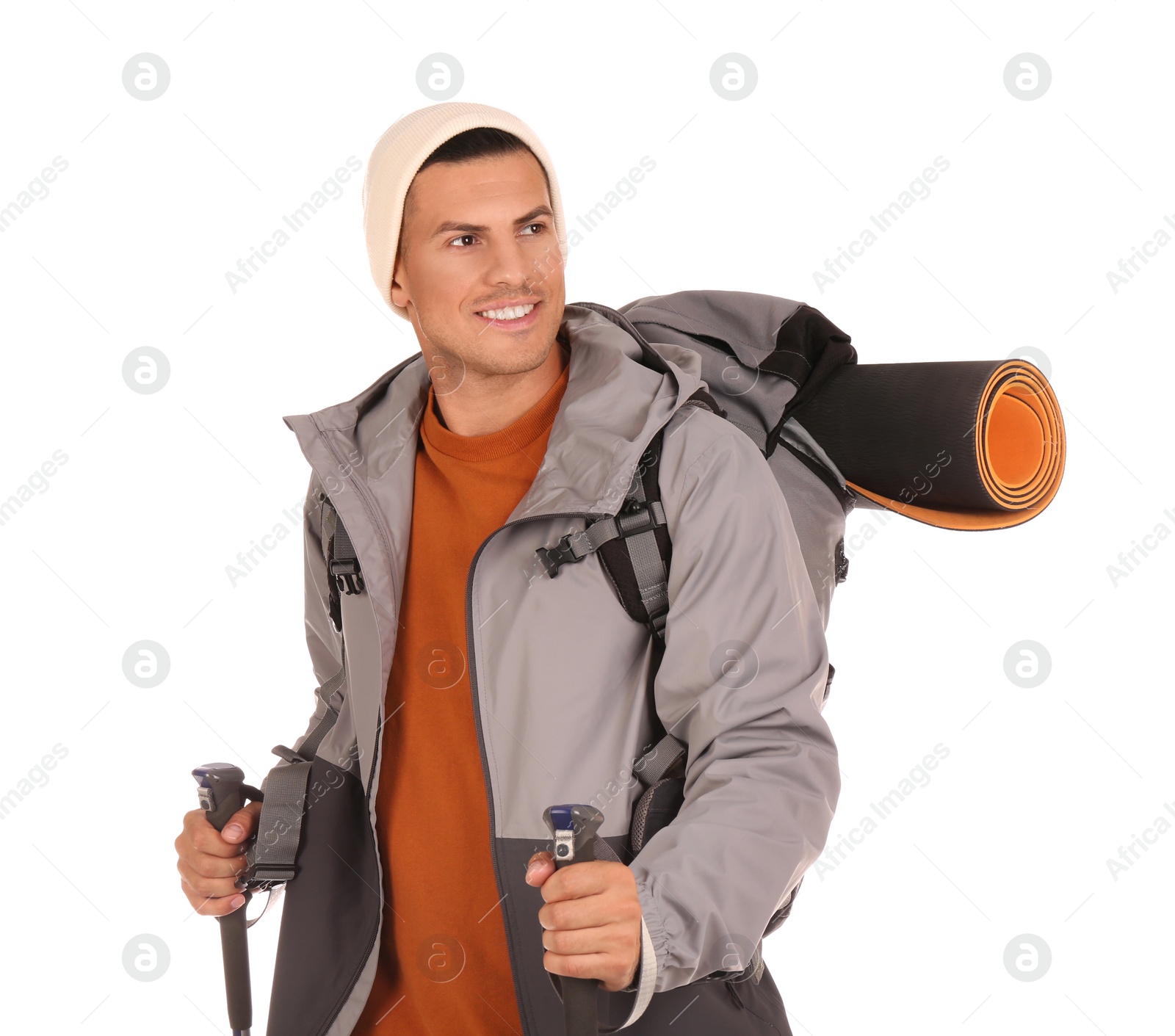 Photo of Male hiker with backpack and trekking poles on white background