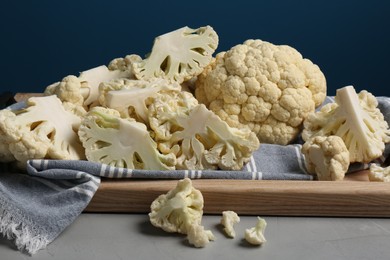 Fresh raw cauliflower on light grey table