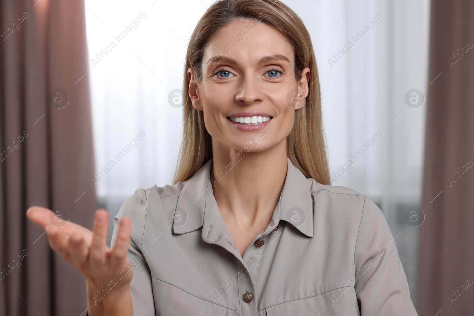 Photo of Happy woman having video call indoors, view from web camera