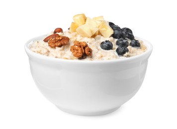 Photo of Tasty boiled oatmeal with blueberries, banana and nuts in bowl isolated on white