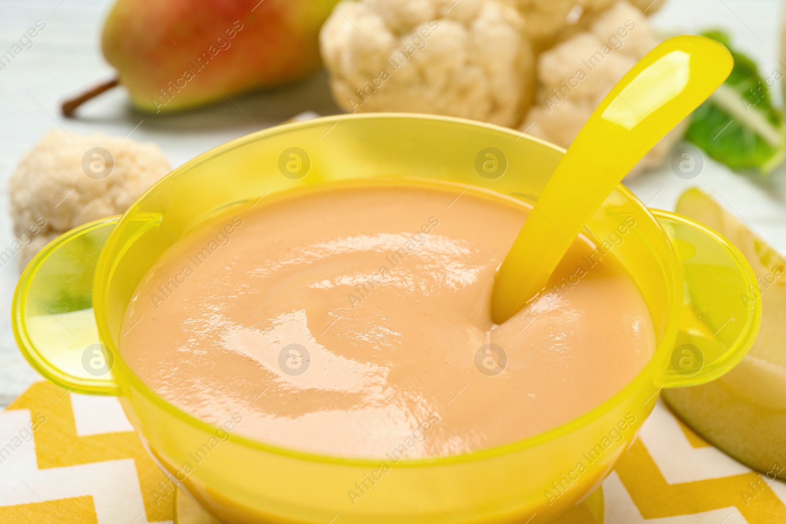 Photo of Healthy baby food and fresh ingredients on table, closeup