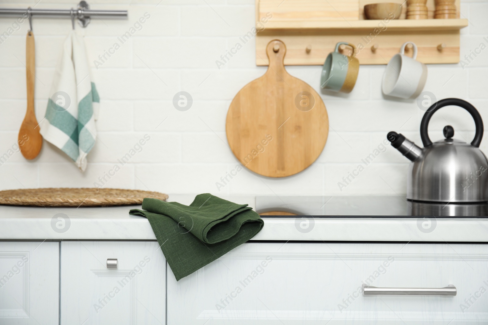 Photo of Clean towel on white countertop in kitchen