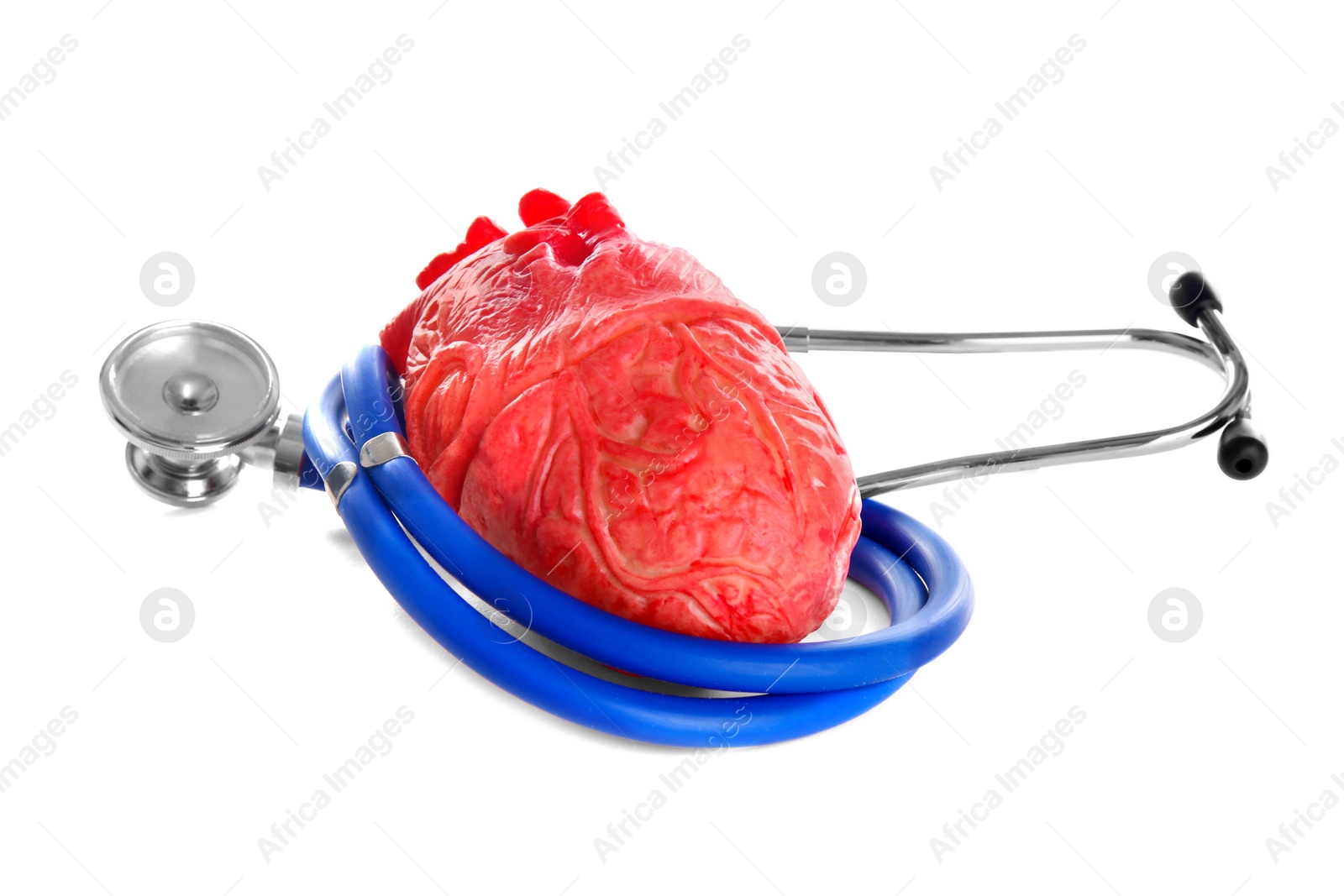 Photo of Stethoscope and model of heart on white background. Heart attack concept