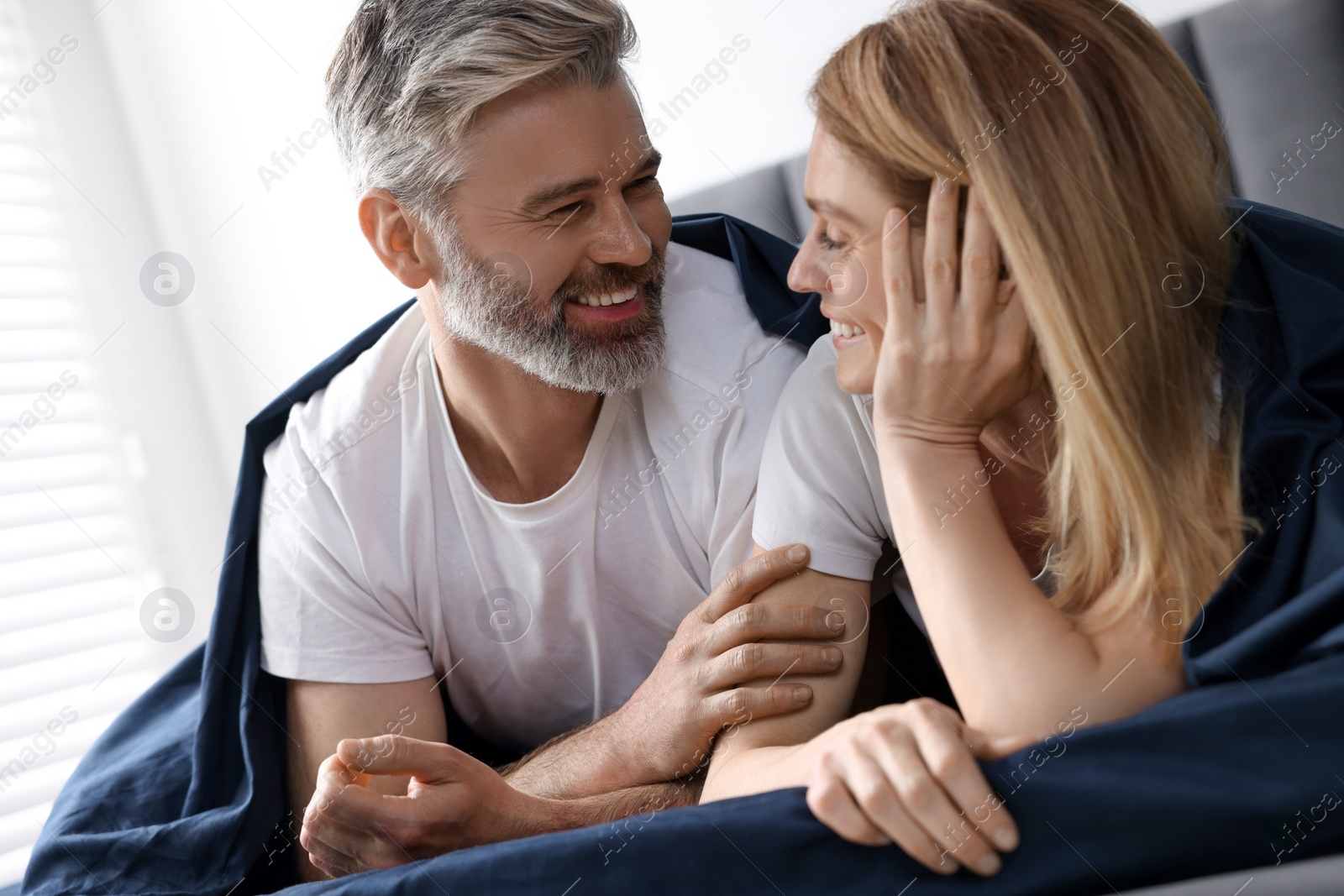 Photo of Lovely mature couple in bed at home