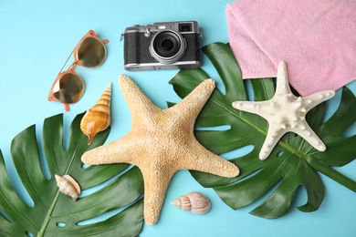 Photo of Flat lay composition with different beach objects on color background