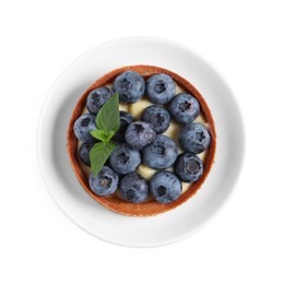 Photo of Tartlet with fresh blueberries and mint isolated on white, top view. Delicious dessert