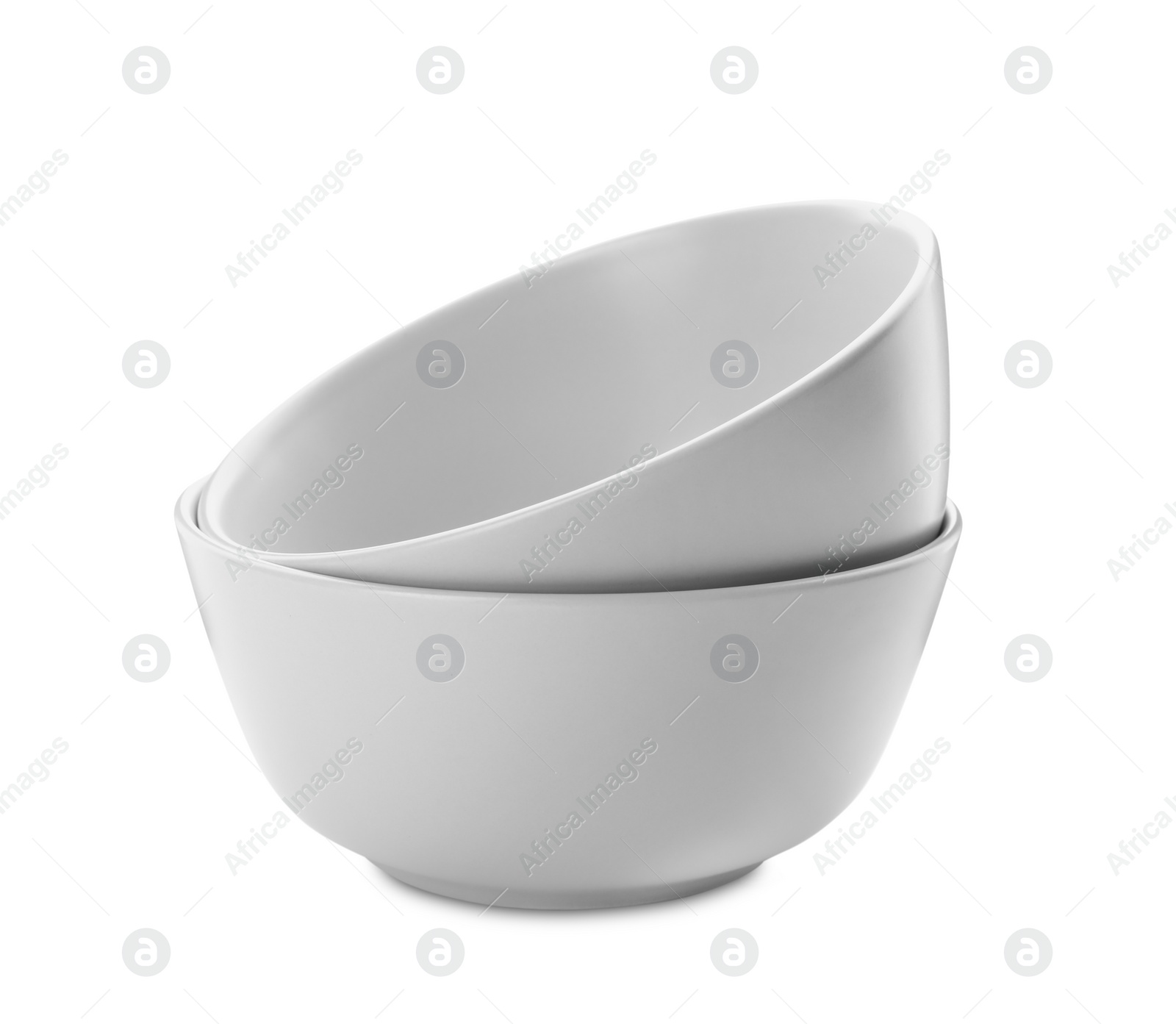 Photo of Clean empty ceramic bowls on white background