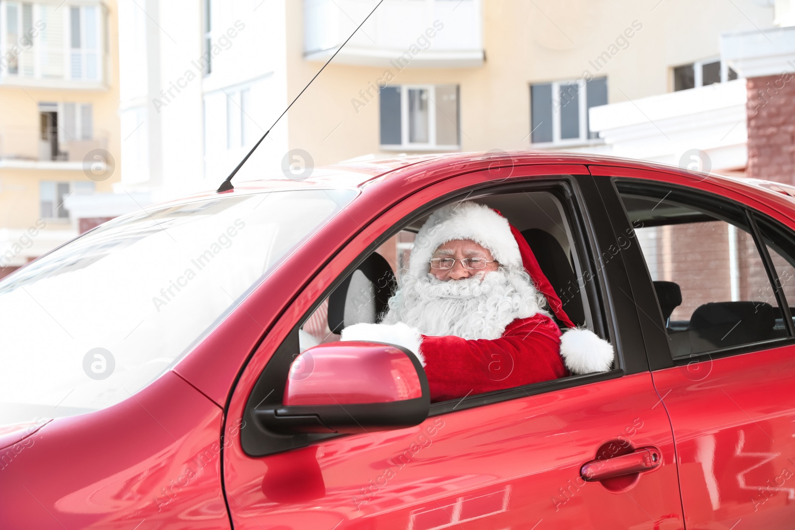 Photo of Authentic Santa Claus in car, view from outside