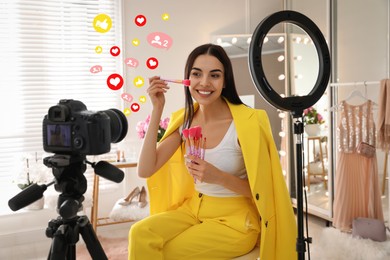 Blogger with brushes recording video in dressing room at home