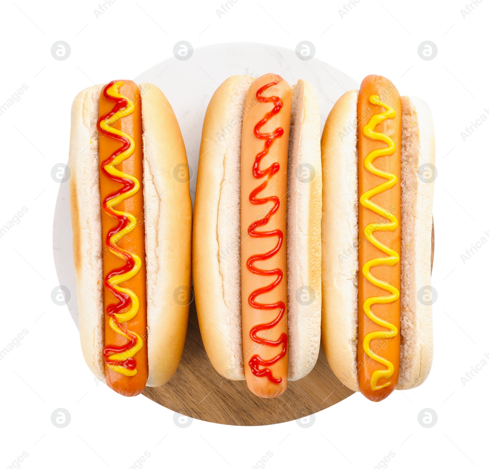 Photo of Delicious hot dogs with sauces isolated on white, top view