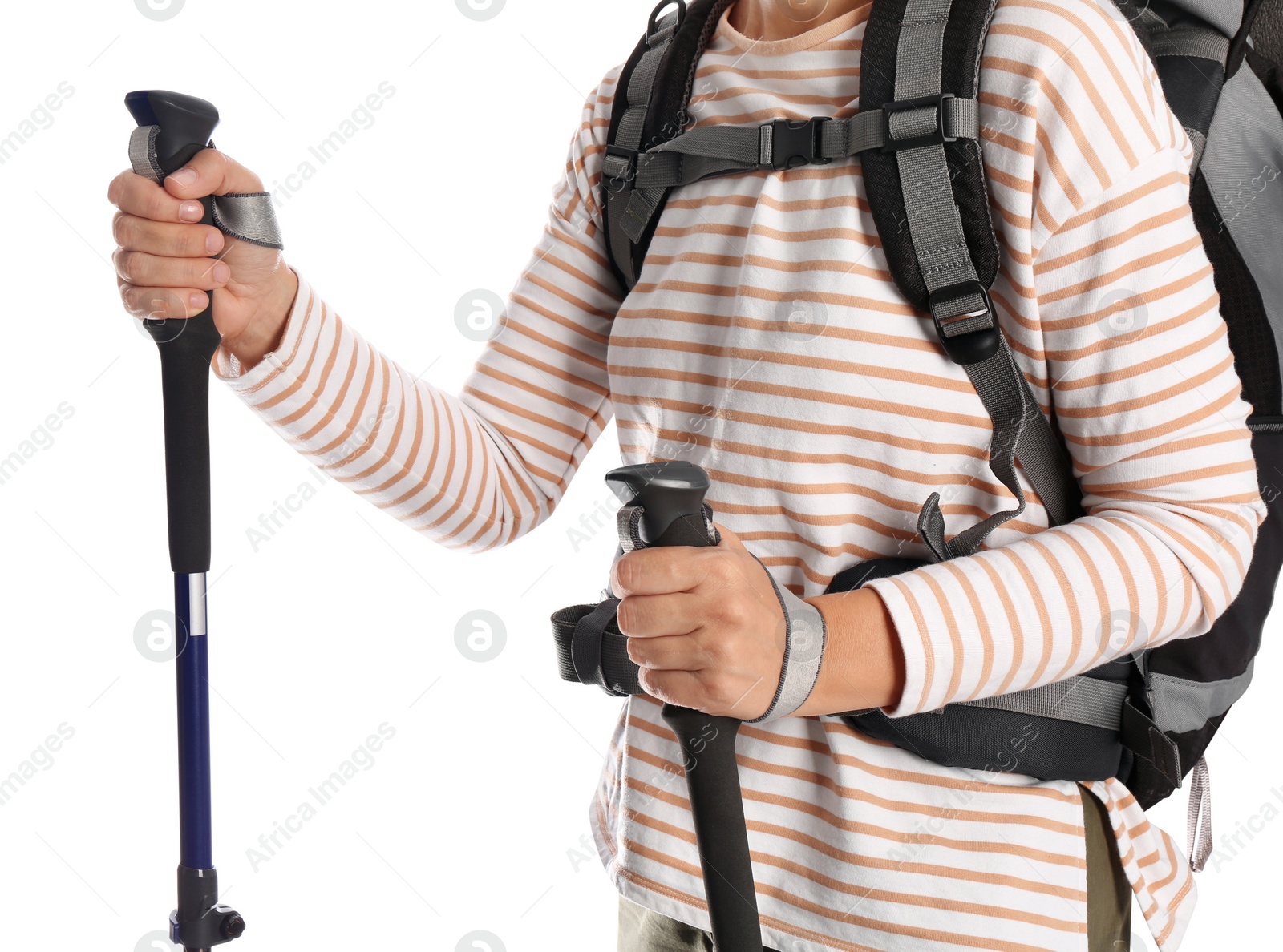 Photo of Female hiker with backpack and trekking poles on white background, closeup