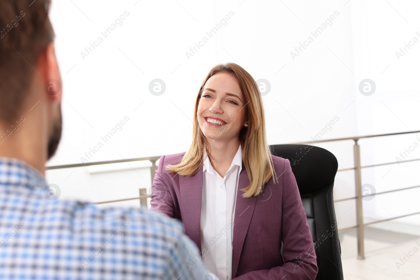 Photo of Human resources manager conducting job interview with applicant in office