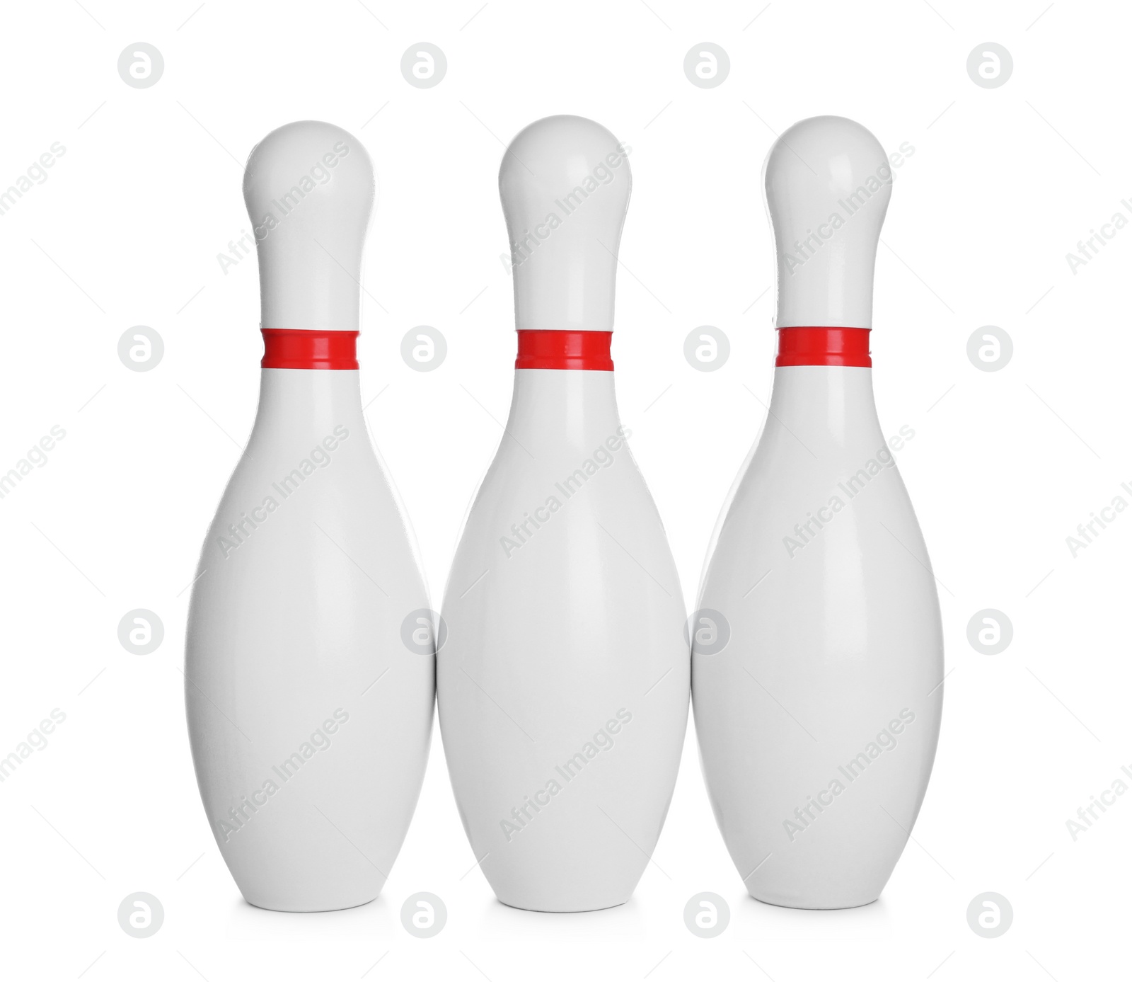 Photo of Bowling pins with red stripes isolated on white