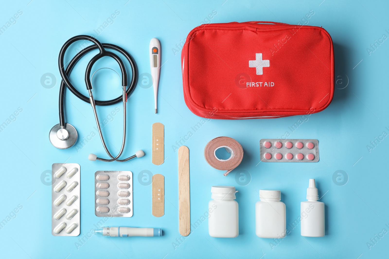 Photo of Flat lay composition with first aid kit on color background