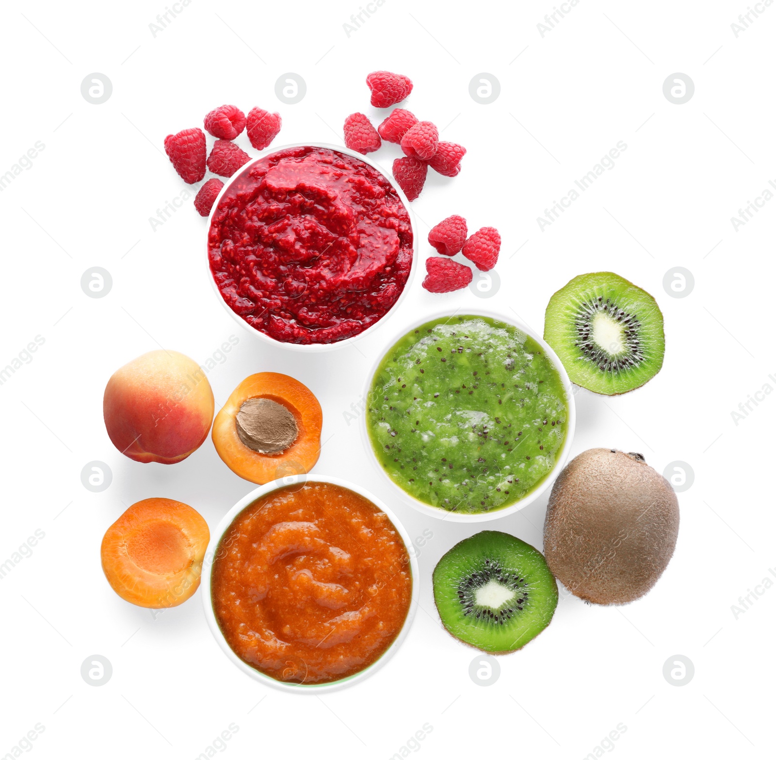 Photo of Different puree in bowls and fresh ingredients on white background, top view