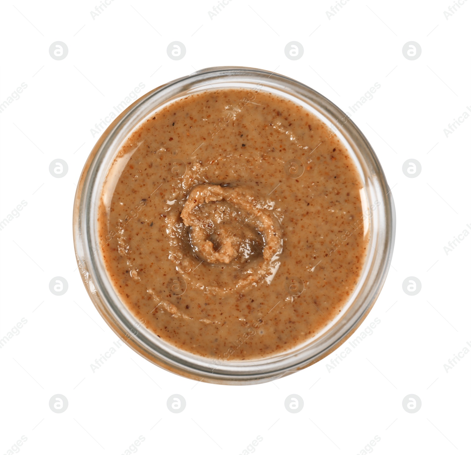 Photo of Delicious nut butter in jar isolated on white, top view