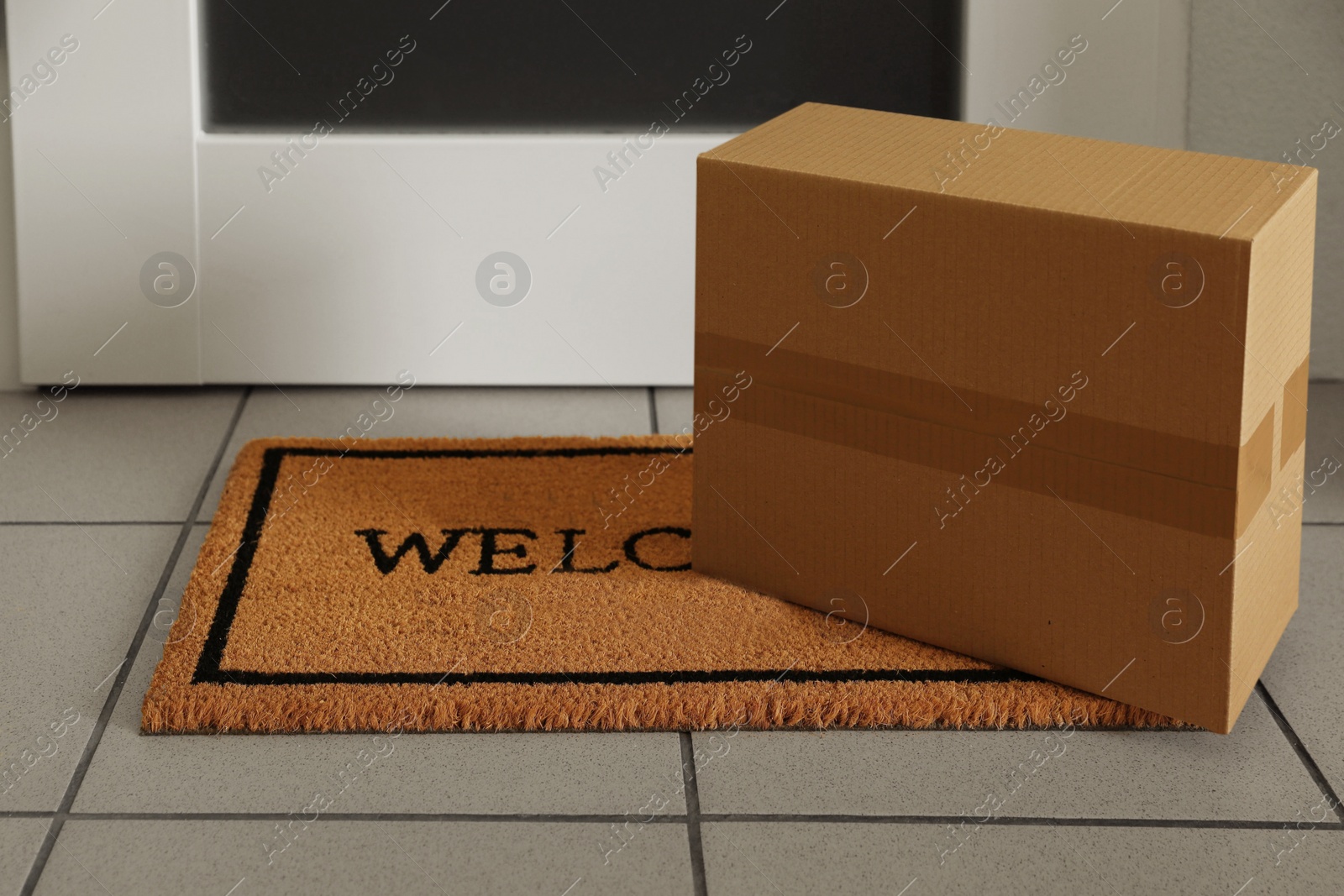 Photo of Parcel delivered on mat near front door