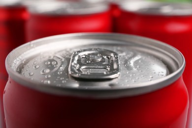 Photo of Energy drink in wet can, closeup. Functional beverage
