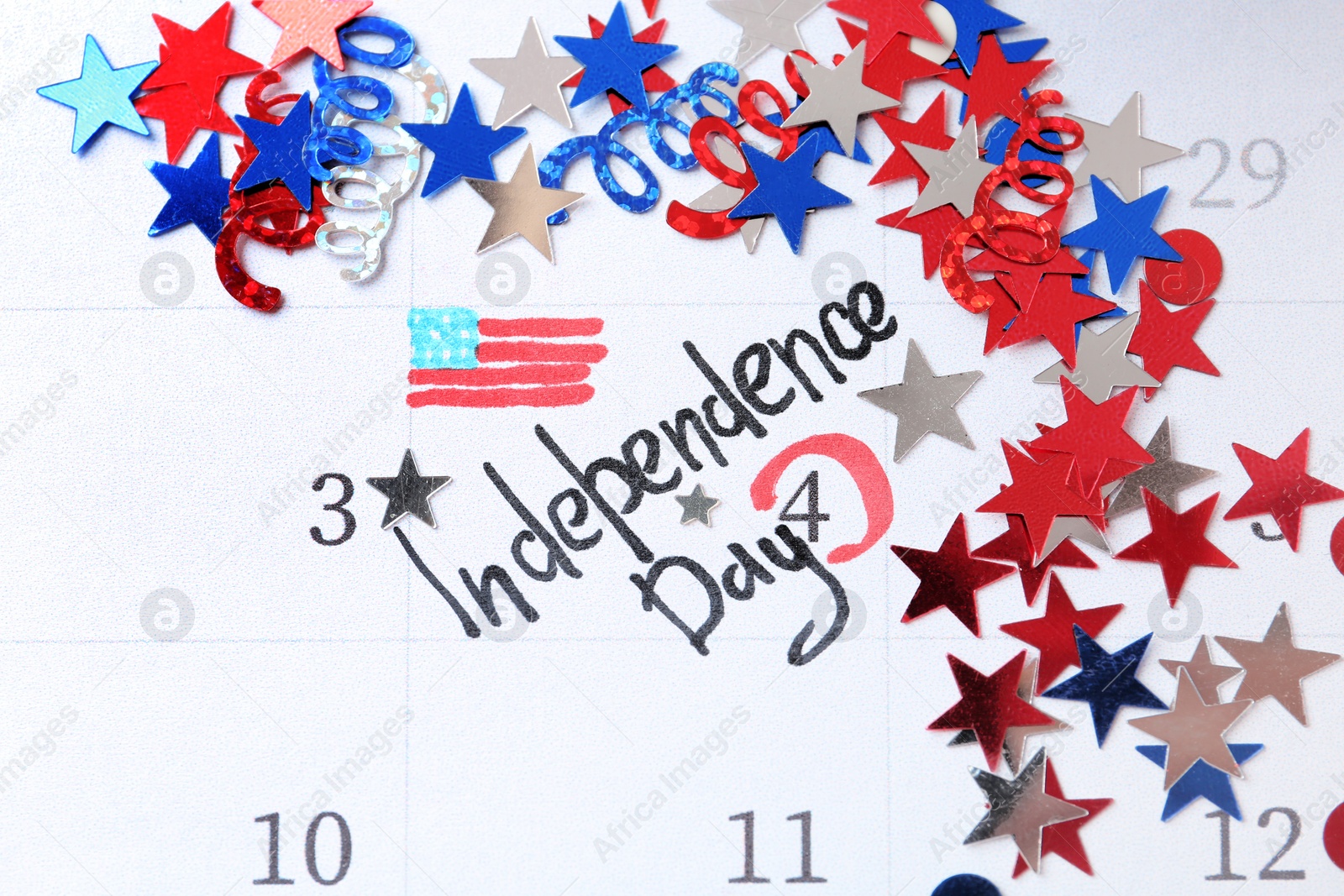 Photo of Composition with calendar and colorful confetti. USA Independence Day