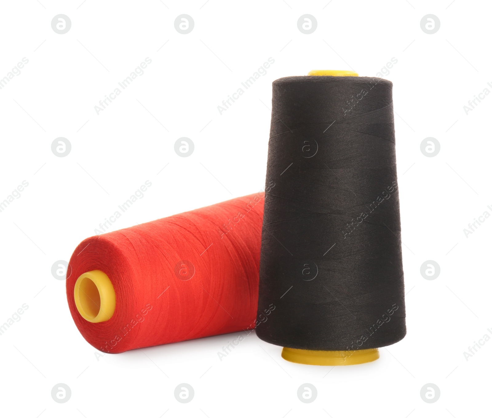 Photo of Different colorful sewing threads on white background