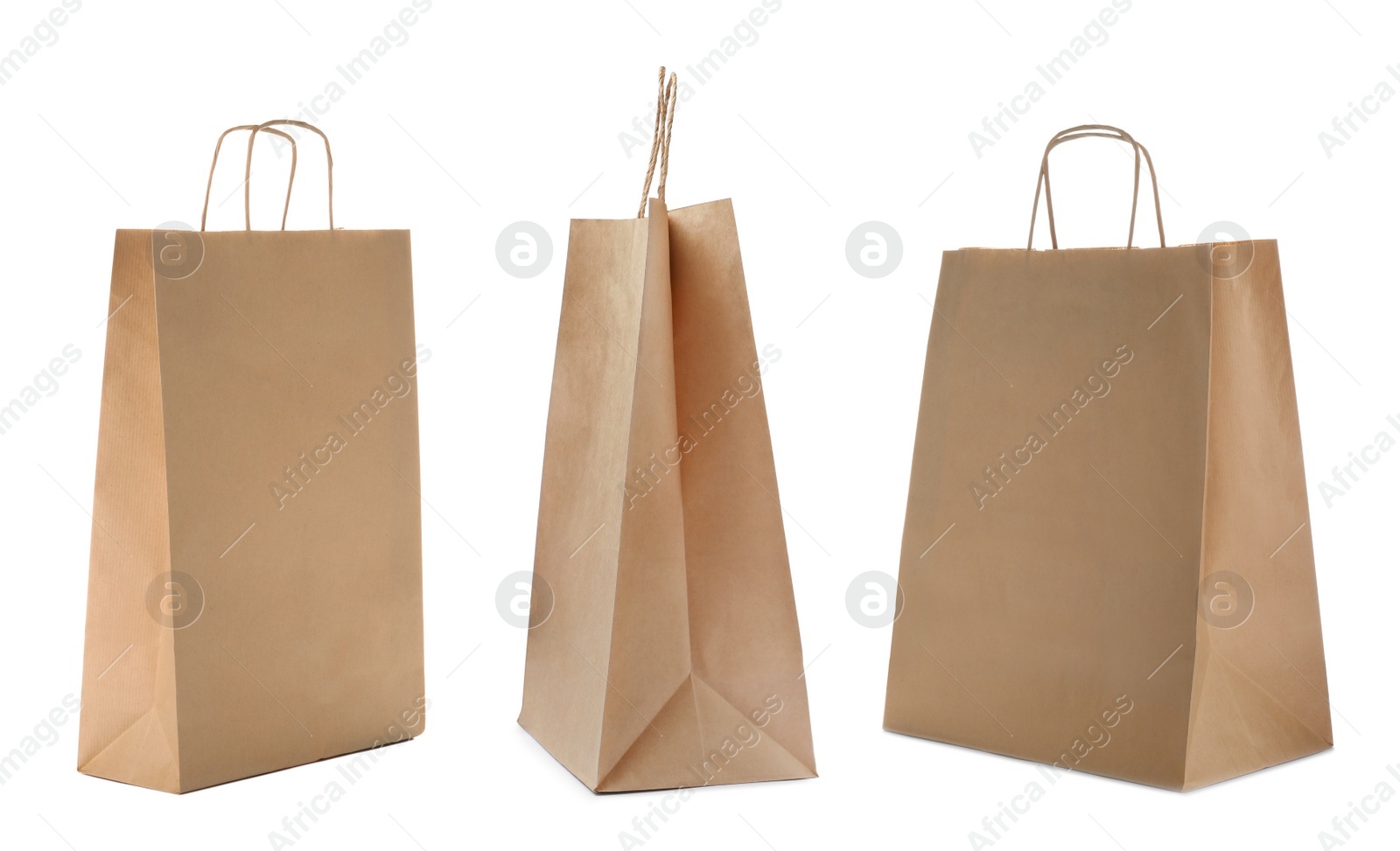 Image of Set with kraft paper bags on white background