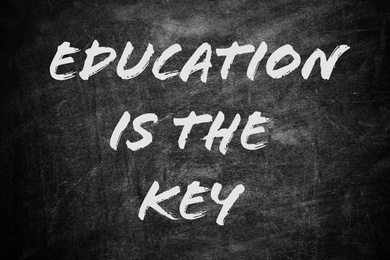 Image of Phrase EDUCATION IS THE KEY written on chalkboard. Adult learning
