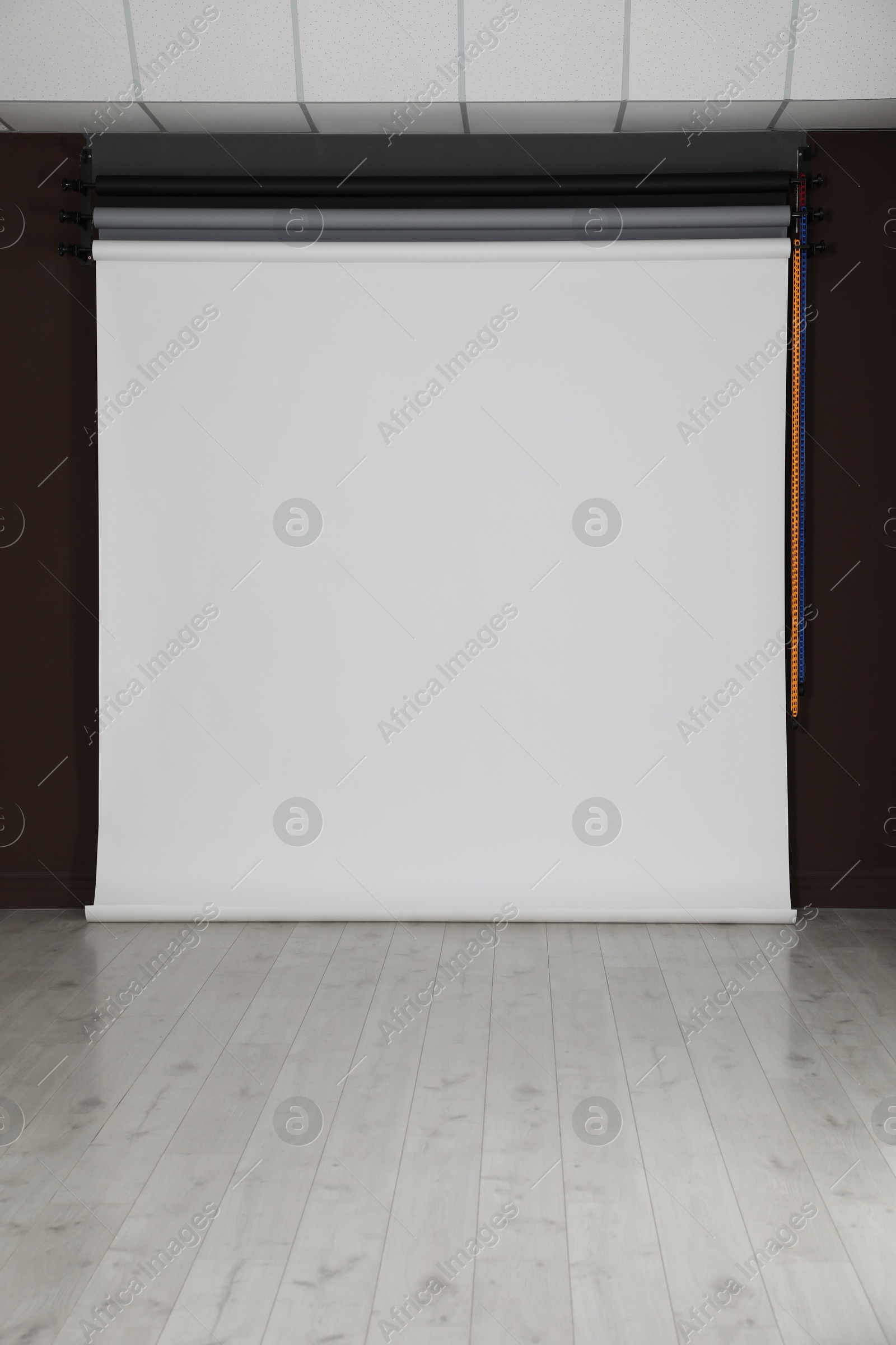 Photo of Empty white photo background. Professional studio equipment