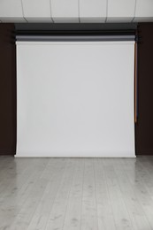 Photo of Empty white photo background. Professional studio equipment