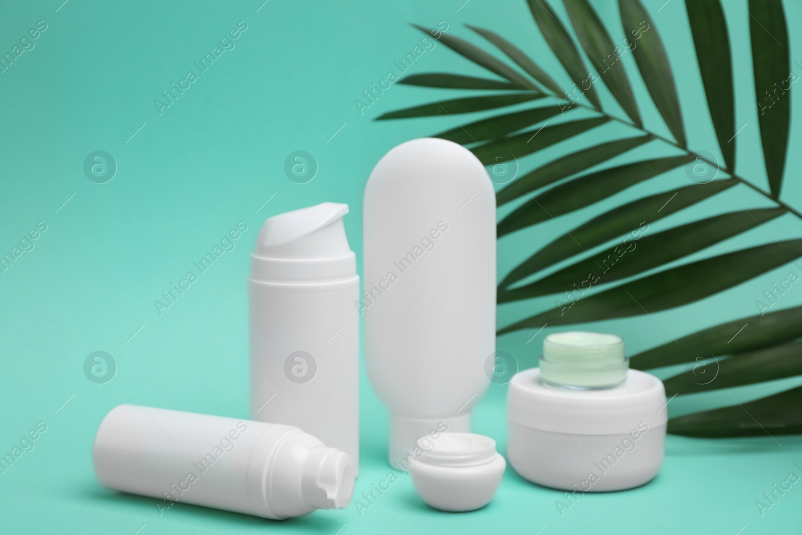 Photo of Composition with cosmetic products on color background