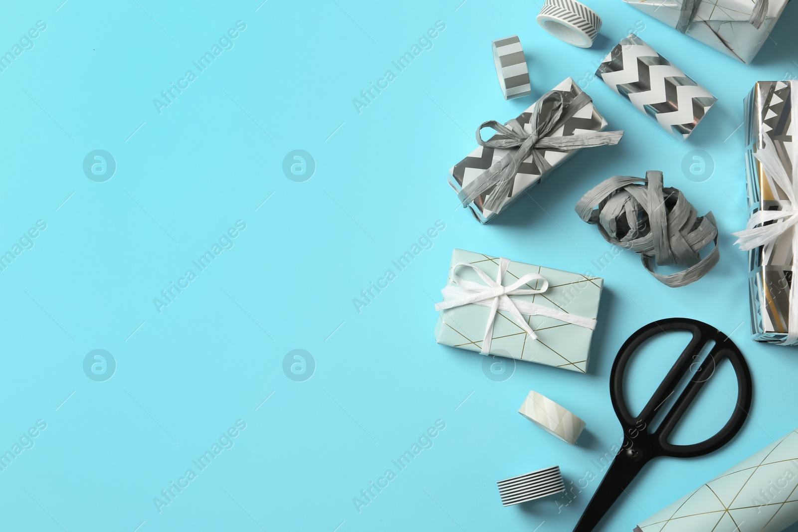 Photo of Flat lay composition with beautiful gift boxes and space for text on color background